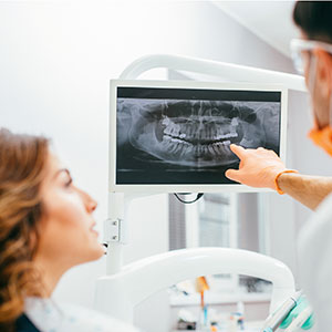 Doctor and patient looking at a dental xray