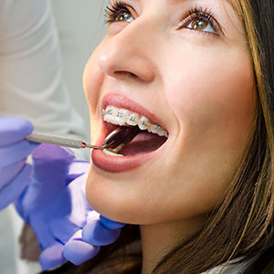 Woman with braces having checkup