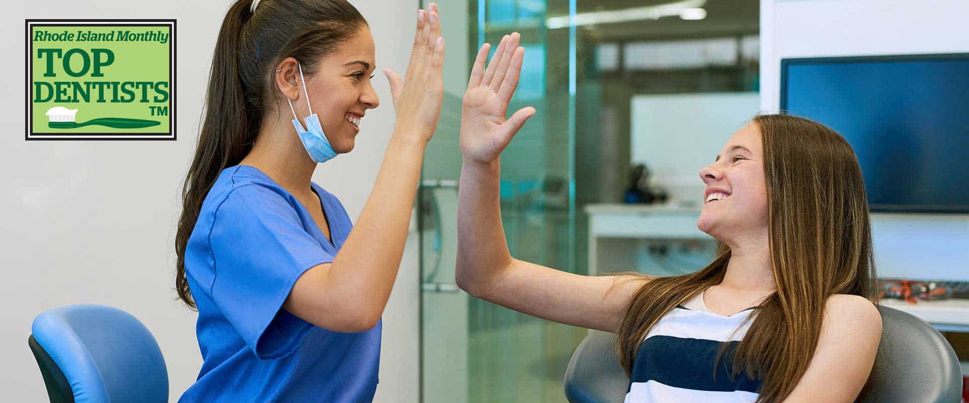 Staff and teen giving high fives